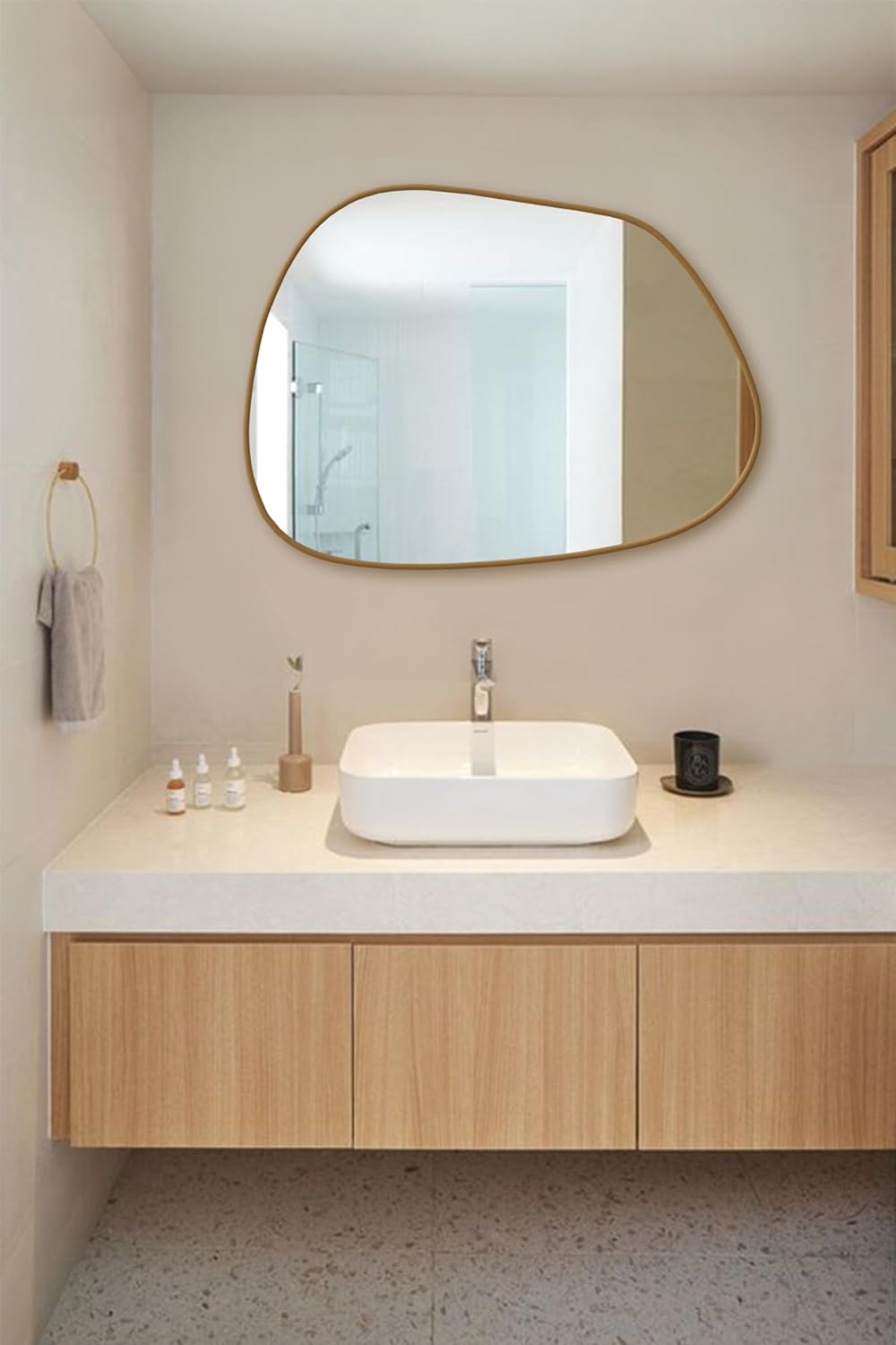 Amorphous Asymmetrical Wall Mirror styled in a modern living room