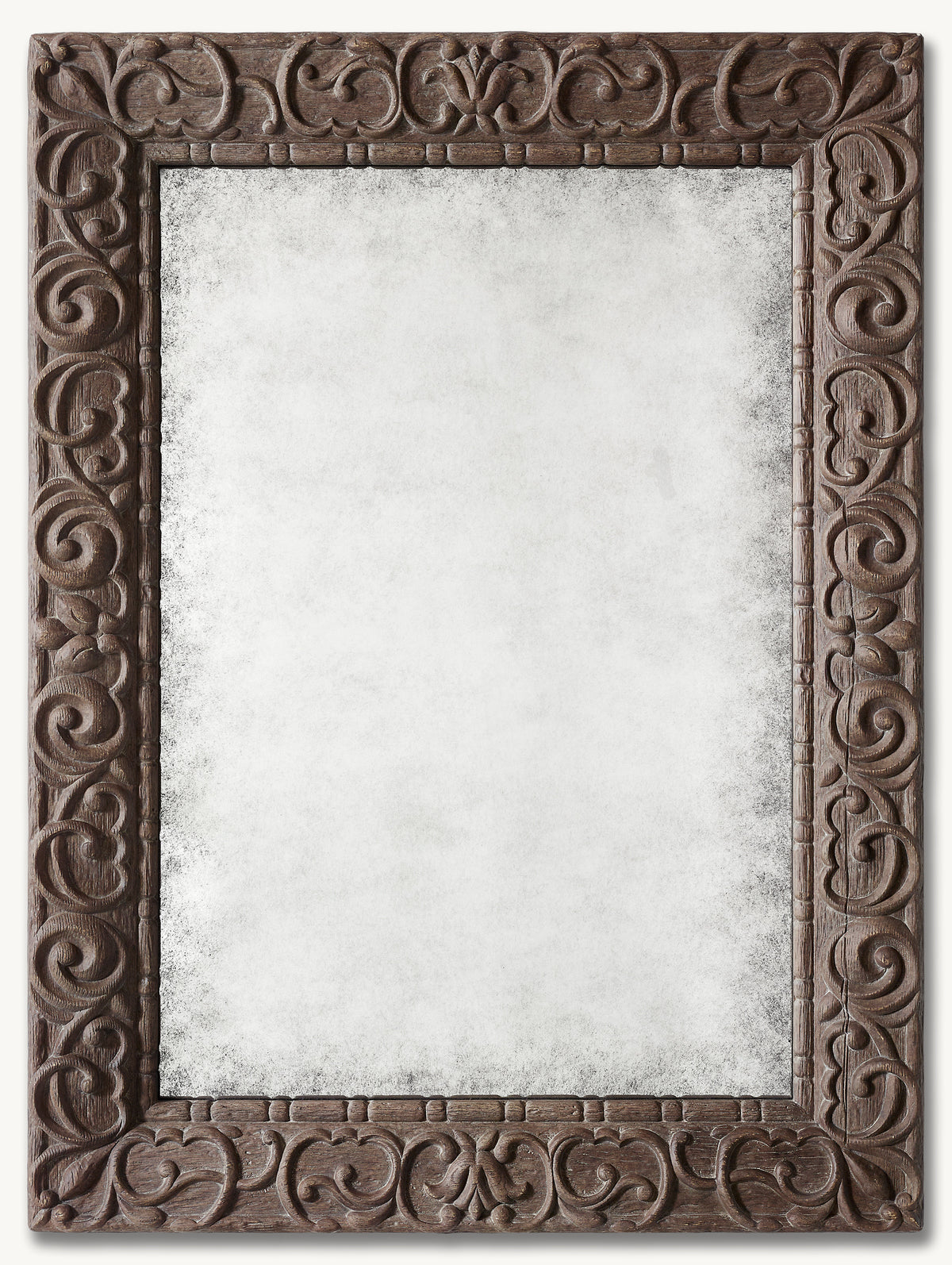 Donatello Mirror – front view of the antiqued mirror in a carved scroll-pattern frame
