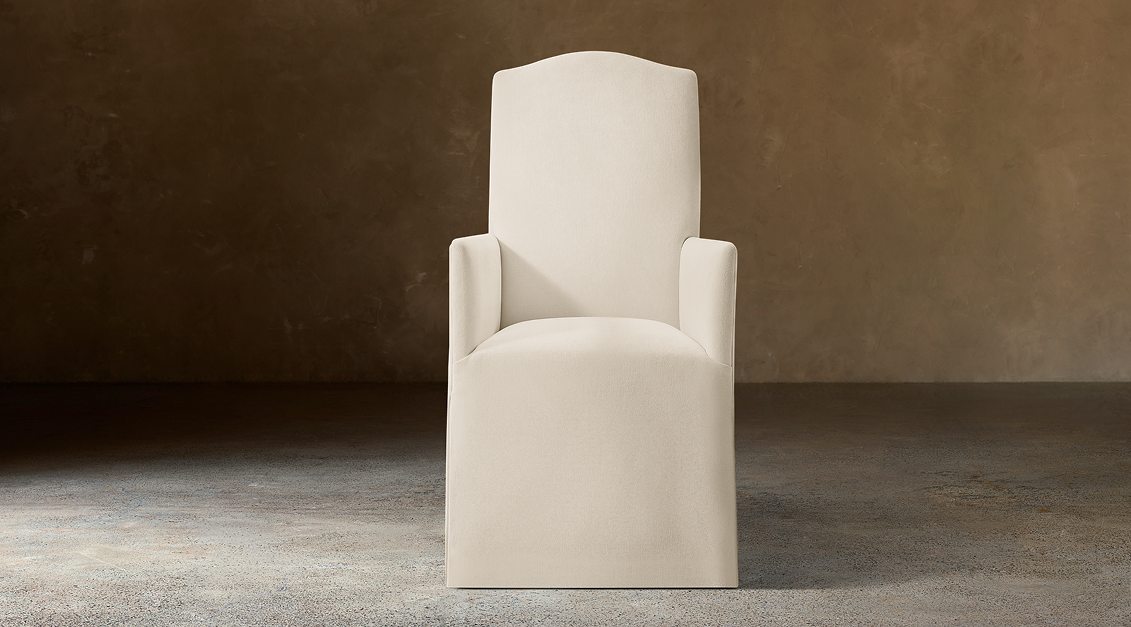 Alexandria Camelback Fabric Dining Armchair – front view in natural-toned upholstery