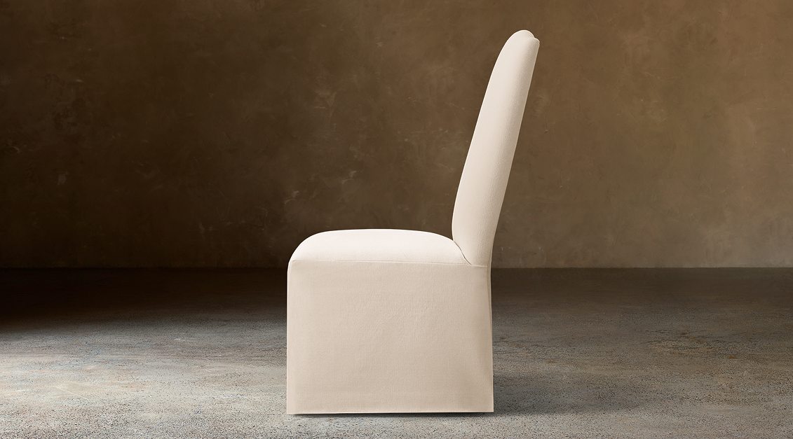 Alexandria Camelback Fabric Dining Side Chair – side view in natural-toned upholstery