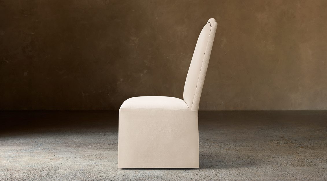 Alexandria Camelback Fabric Dining Side Chair With Nailheads – side view in natural-toned upholstery