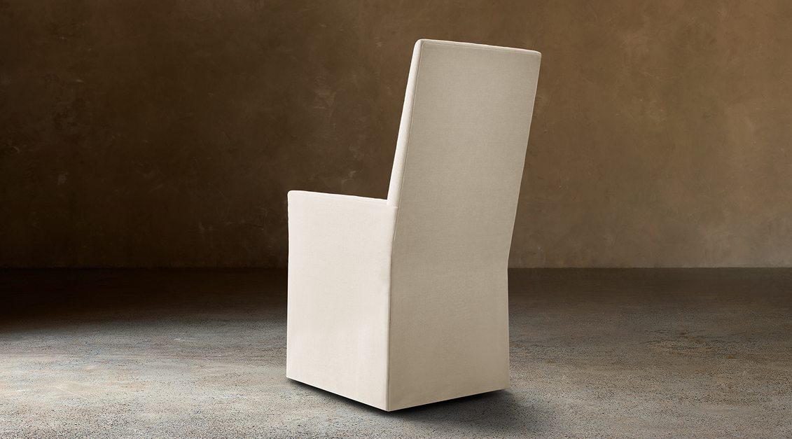 Alexandria Fabric Dining Armchair – rear three-quarter view in natural-toned upholstery