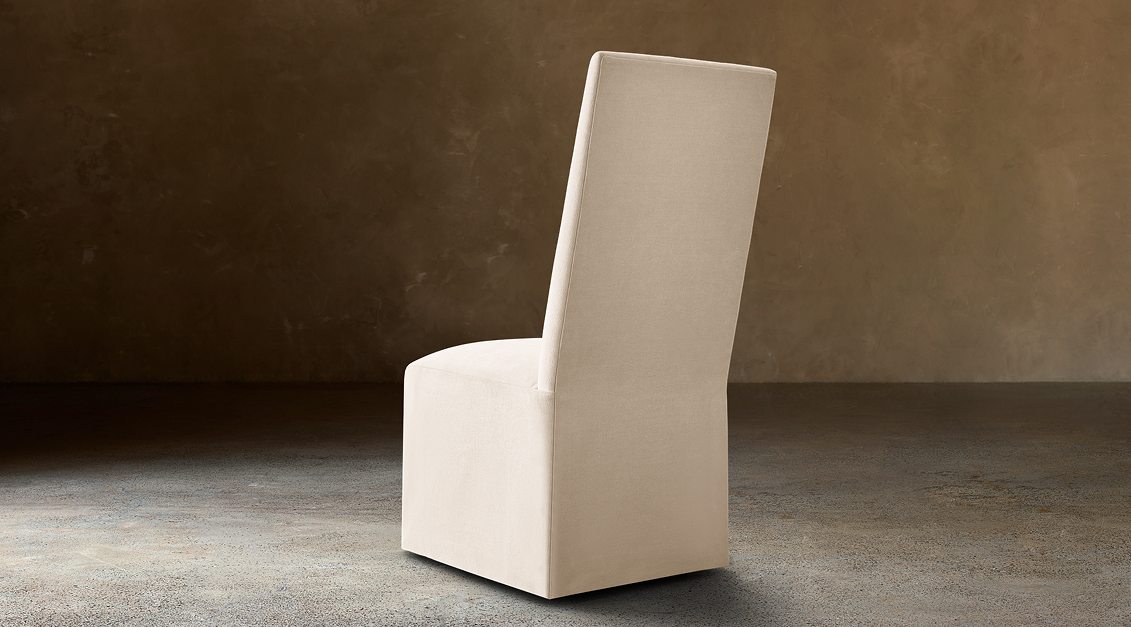 Alexandria Fabric Dining Side Chair With Nailheads – rear three-quarter view in natural-toned upholstery