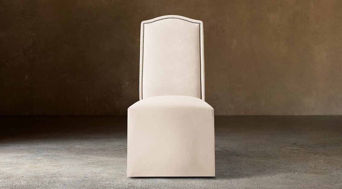 Alexandria Camelback Fabric Dining Side Chair With Nailheads – front view in natural-toned upholstery